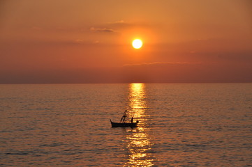 fishing boat at sunset in Camogli, Genoa province, Liguria, Italy