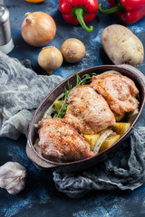 Chicken thighs and potatoes ready for baking