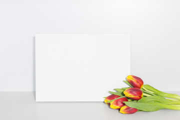 Blank canvas with flowers. Mockup poster frame.