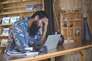 Men have mustaches that are stressed about working in coffee shops.