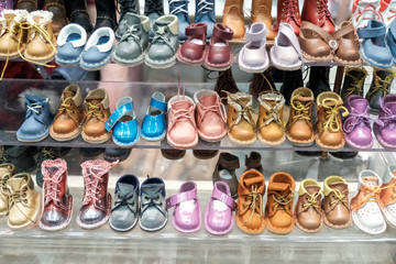 Children's shoes on the shelves.
