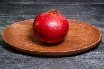 red apple on wooden table