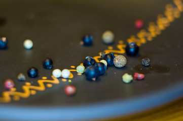 juniper berries and allspice in a ceramic plate