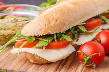 sandwich on a wooden on cutting board