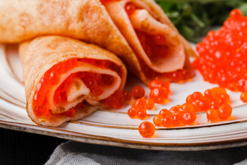 Pancakes with red caviar, carnival in Russiaa