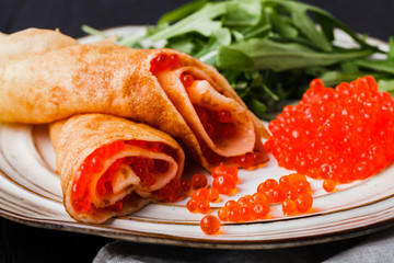 Maslenitsa festival carnival meal - pancake with caviar