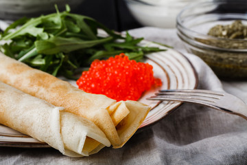 Maslenitsa festival carnival meal - pancake with caviar