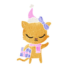 cute retro cartoon of a cat with present wearing santa hat