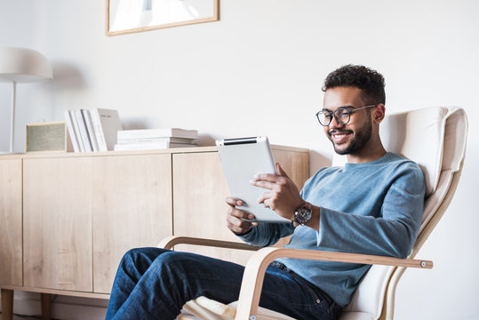  Young Man Using Digital Tablet At Home. Handsome Student Resting T In His Room. Home Work Or Study, Freelance Concept