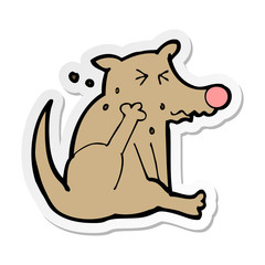 sticker of a cartoon dog scratching