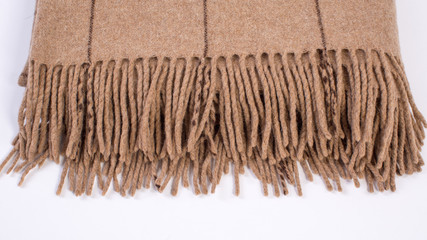 folded brown fringed plaid checkered plaid