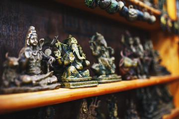 Souvenirs of Indian gods for tourists at the market in Northern Goa