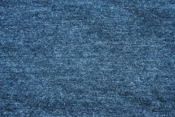 Naklejka premium Blue texture background of faded soft cotton shirt fabric surface. Empty cloth and plain cotton jersey design, flat lay top view of old navy blue solid clothing material 