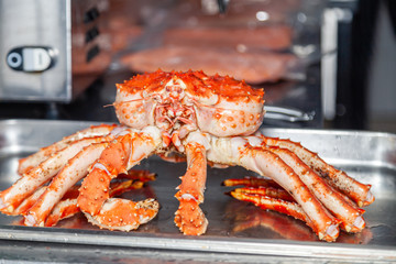 Carving fresh red big boiled prepared blue kamchatka crab. Concept useful seafood in menu, chef premium restaurant preparing crab for serving for guests, clients