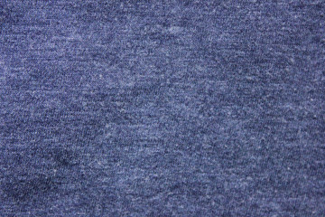 Pale navy blue texture background of soft cotton shirt fabric surface. Empty cloth material and plain design, flat lay top view of blue hoddie worn pattern