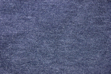 Pale navy blue texture background of soft cotton shirt fabric surface. Empty cloth material and plain design, flat lay top view of blue hoddie worn pattern