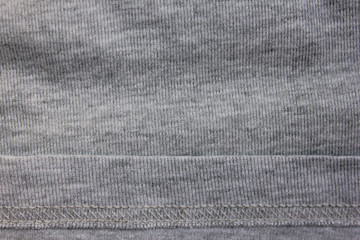 Grey fabric texture of simple cotton shirt. Linen material with seam of plain gray jacket, empty clothes background