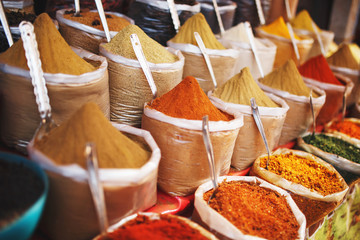 Indian colored spices at local market. A variety of spices of different colors and shades, flavors...