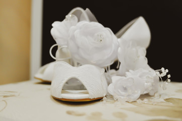 Special wedding decoration. tables, flowers, shoes, earrings and wedding dress. selective focus.