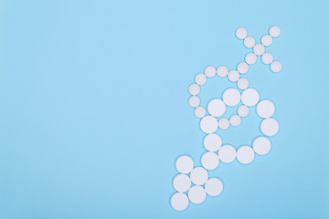  Concept for genders, feminine and masculine, man and woman, boy and girl. Feminine and masculine principles are symbolic symbols laid out from tablets on a blue background.