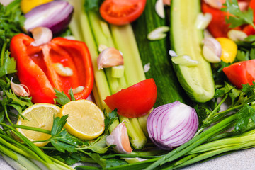 Vegetables.  Assortment of fresh vegetables close up. Still life of fresh fruit: pepper, lemon, tomato, cucumber, onion, green onion, parsley, garlic, celery. Fresh vegetables.