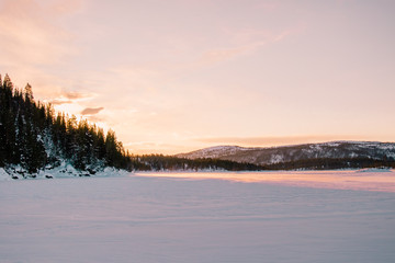 Sunrise over a frozen lake in Norway