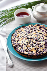 Homemade blueberry pie on blue plate
