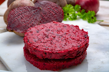 Healthy vegetarian food, raw round burgers made from red beetroot