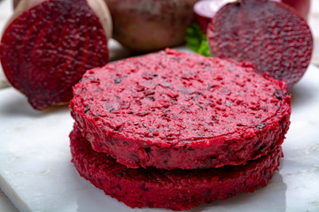 Healthy vegetarian food, raw round burgers made from red beetroot
