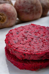 Healthy vegetarian food, raw round burgers made from red beetroot
