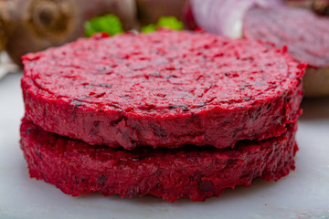 Healthy vegetarian food, raw round burgers made from red beetroot