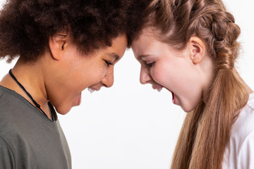 Emotional and expressive kids leaning on each other