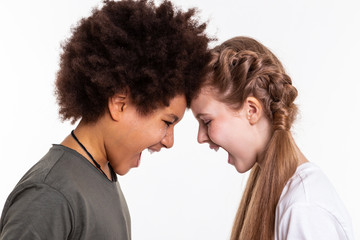 Aggressive good-looking children releasing emotions on each other