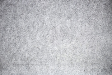 Fototapeta premium Gray fabric background texture pattern. felt textiles. Place for text