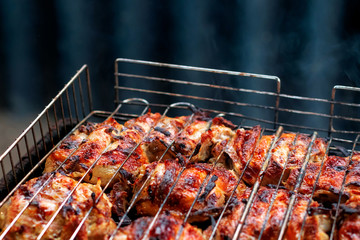 Grilled chicken steak on barbecue grill.