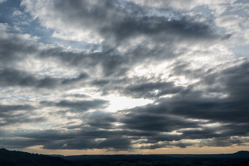 Obraz premium Dramatic sky at sunset over the mountain.