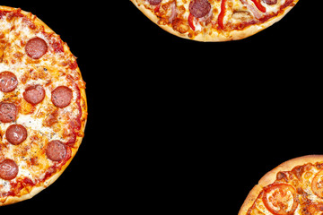 Fresh pizza with meat beaf chicken pork, tomatoes, vegetables, ushrooms on dark black background closeup