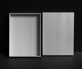 Grey empty wooden gift box on a dark background. Advertisement template. 3D rendering.