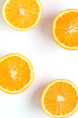 slices of fresh orange on white background