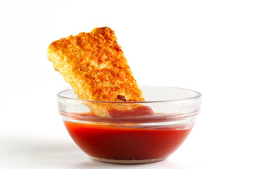 nuggets in a bowl with ketchup on a white background
