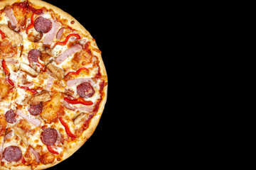 Fresh pizza with meat beaf chicken pork, tomatoes, vegetables, ushrooms on dark black background closeup
