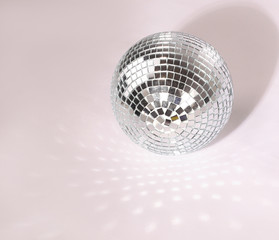beautiful disco ball on yellow background isolated.