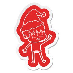 cartoon  sticker of a exhausted boy wearing santa hat