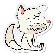 distressed sticker of a cartoon grinning fox