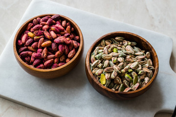Raw and Roasted Wooden Bowl of Peeled Pistachios without Shell / with No Shell