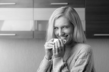 Portrait of a  mid age woman with cup of coffee.