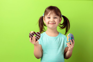 Happy girl with donuts.