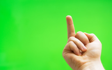 Male hand shows middle finger. Chroma key. Place for your advertisement.