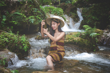 Fototapeta premium Happy bathing women at the natural waterfall.