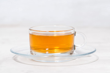 tea in a glass cup on a white background